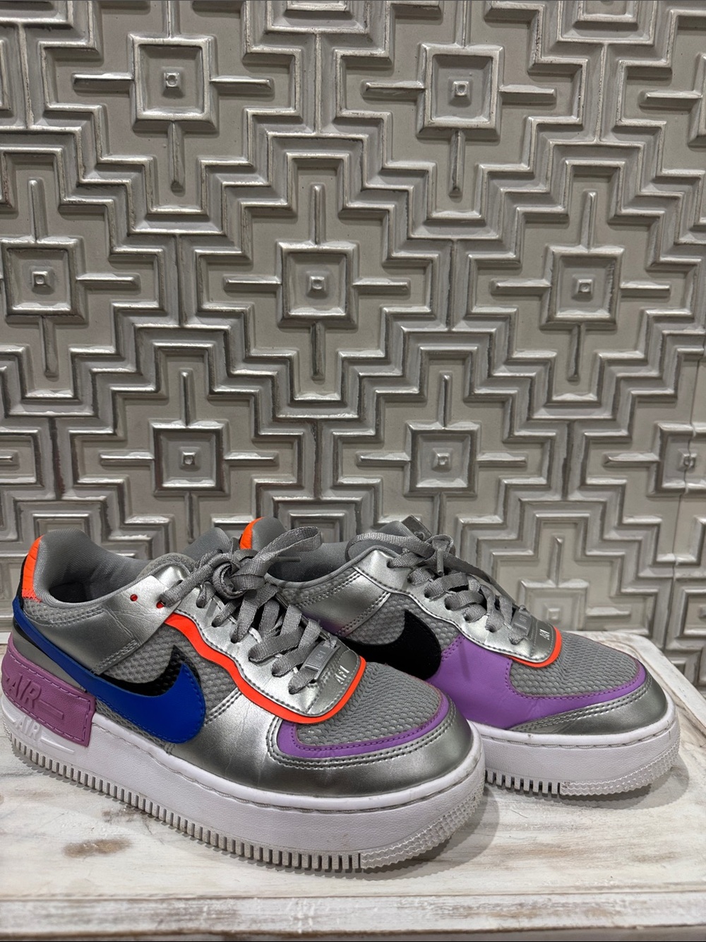 Nike Silver Low-Top Sneakers with Blue, Black, Purple & Orange Accents